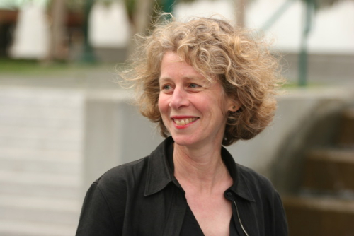 Casual headshot of Nancy Karp, smiling and looking off to her right.